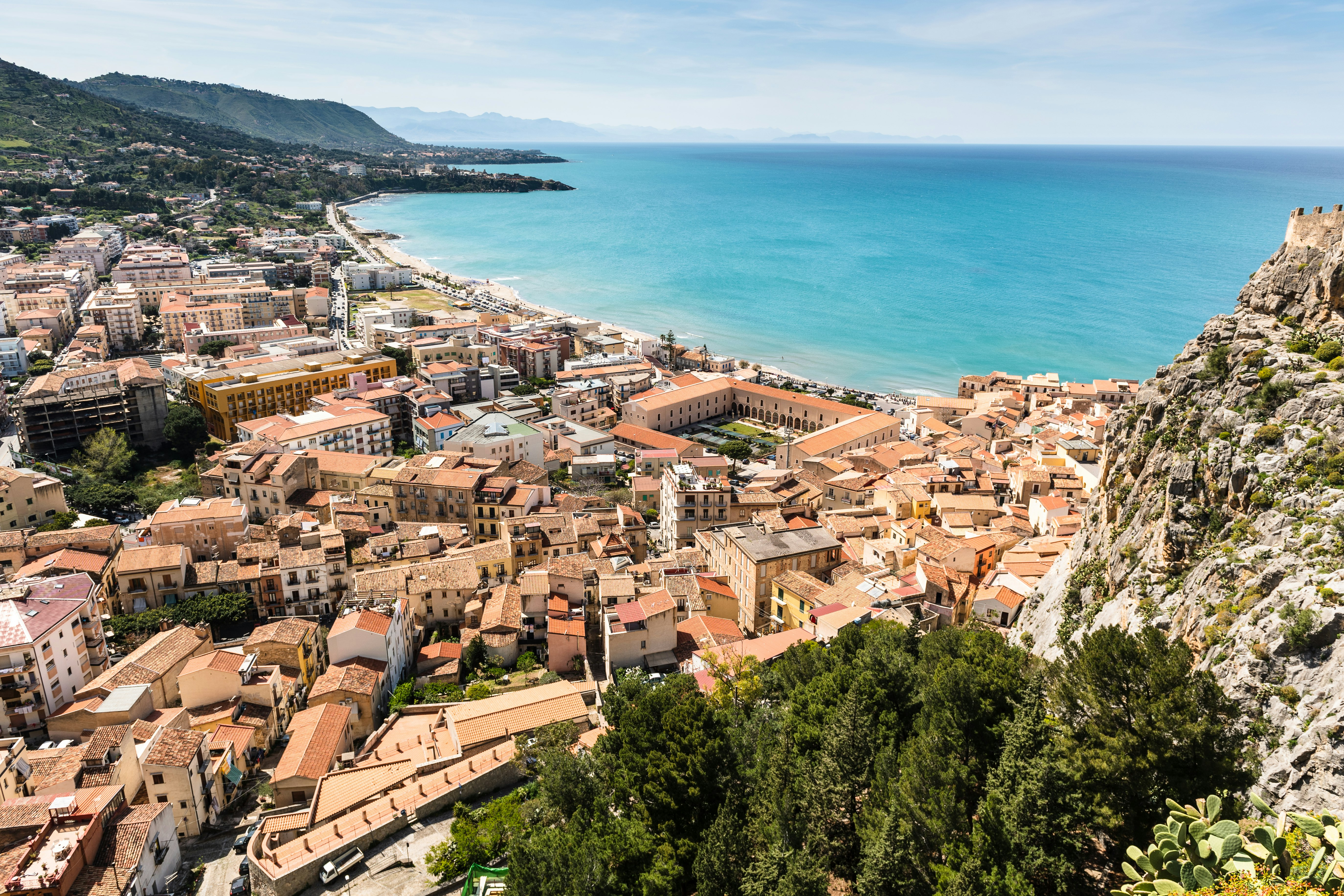 aerial photography of brown town near ocean